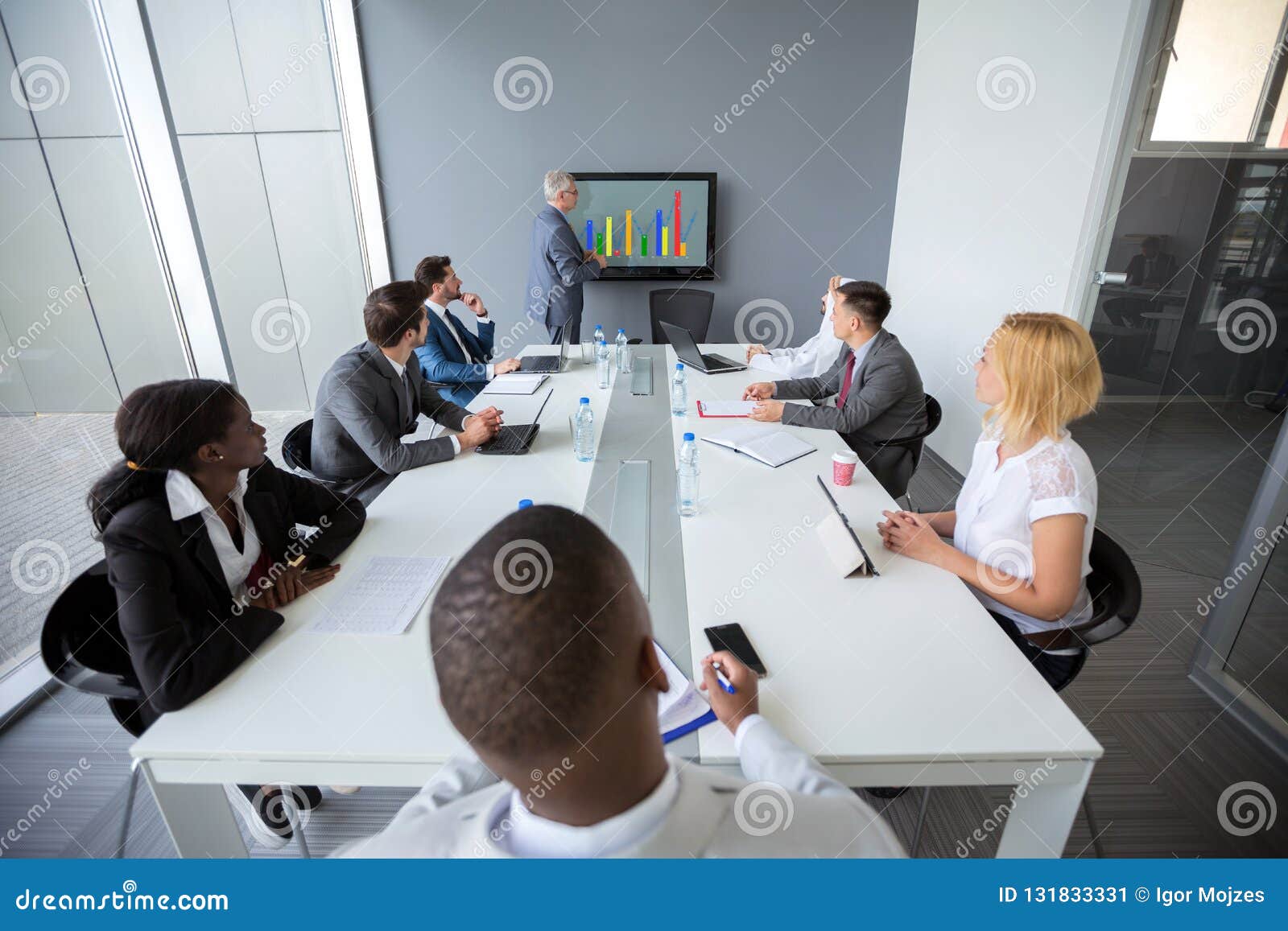 employees at meeting room listen director